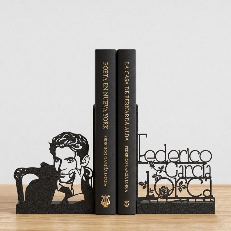 May include: Black metal bookends featuring a silhouette of Federico Garc&iacute;a Lorca and his name. Two black books stand between the bookends, with titles and author's name visible. The bookends add a decorative touch to any bookshelf.