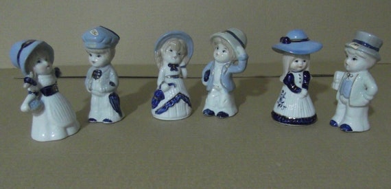 Figurine trio d'enfants en porcelaine ancienne Quelle est la plus belle