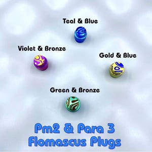 May include: A white ceramic mug with a black handle and the text "But First, Coffee" in a handwritten style. The mug is on a white surface. The mug is likely for hot beverages.