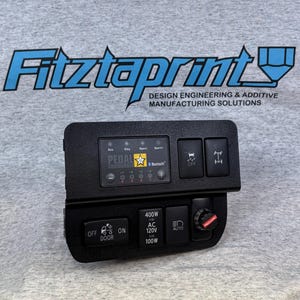 May include: A black control panel with buttons and a knob. The buttons are labeled "Off", "Door", "On", "Auto", and "400W AC 120V 100W". The knob is labeled "Redarc".