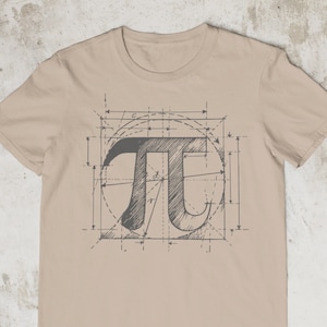 May include: A beige t-shirt featuring a graphic of the mathematical symbol pi, surrounded by a geometric design.