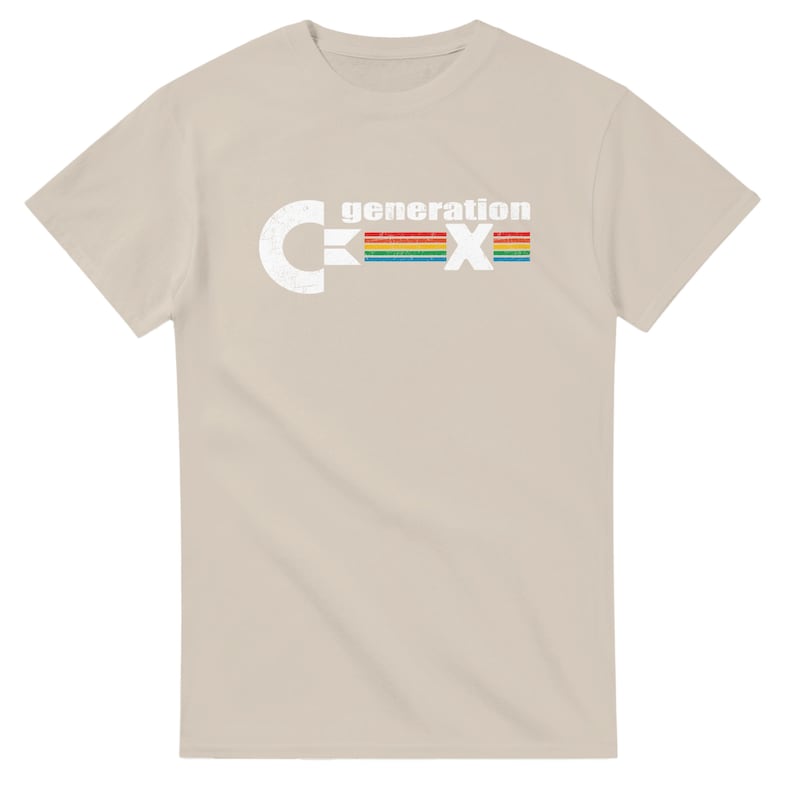 May include: A beige t-shirt with the text "generation X" in white and a rainbow-colored stripe design. The letter "C" is on the left side of the text, and the letter "X" is on the right side.