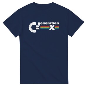 May include: Navy blue t-shirt with the text "generation X" in white and a rainbow-colored stripe. The design features a distressed, vintage aesthetic. The shirt is a short-sleeved crew neck.