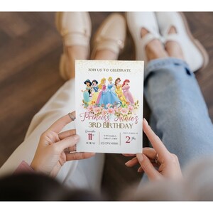 May include: A pink and gold birthday invitation with a picture of Disney princesses. The invitation says "Join us to celebrate Princess Annie's 3rd Birthday" and includes the date and time of the party.