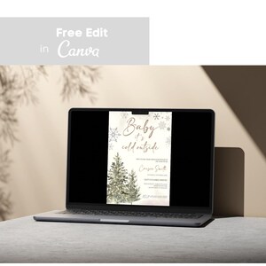 May include: A digital invitation for a baby shower with a winter theme. The invitation features a watercolor illustration of two pine trees with snowflakes and the text "Baby it's cold outside".
