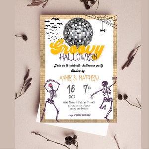 May include: A Halloween party invitation with a gold mosaic border. The invitation features a disco ball, bats, and skeletons. Text includes "Groovy Halloween", party details, and the names "Annie & Mathew".