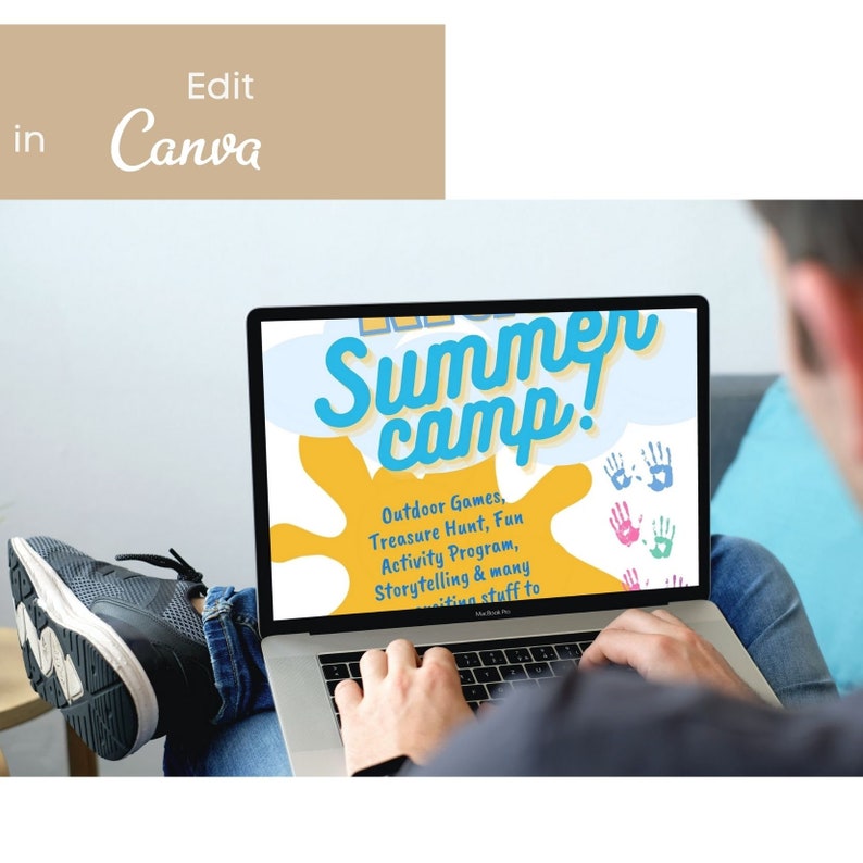 May include: A laptop computer screen displaying a colorful graphic for a summer camp. The graphic includes the text "Summer Camp!" in a blue and yellow font. The text "Outdoor Games, Treasure Hunt, Fun Activity Program, Storytelling & many exciting stuff to" is also displayed on the screen.