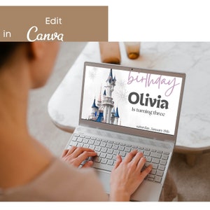 May include: A laptop screen displaying a birthday invitation with a picture of Cinderella's castle from Disney World. The invitation reads "birthday Olivia is turning three saturday, January 15th".