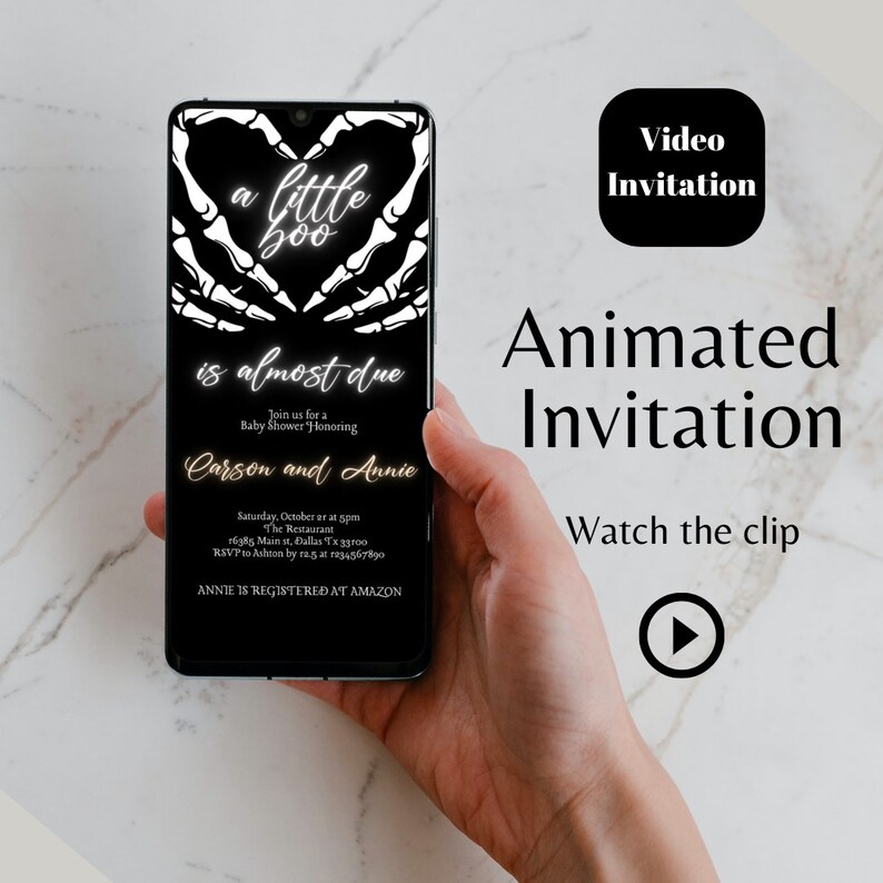 May include: A black and white animated video invitation for a baby shower. The invitation features a skeleton hand holding a heart with the text "a little boo is almost due". The invitation also includes the names "Carson and Annie" and the text "Annie is registered at Amazon".