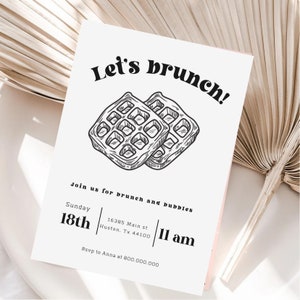 May include: A black and white illustration of two waffles on a white background. The text "Let's brunch!" is at the top of the invitation. The text "Join us for brunch and bubbles" is below the waffles. The text "Sunday 18th" is on the left side of the invitation. The text "16385 Main st Huston. Tx 44100" is on the right side of the invitation. The text "11 am" is below the address. The text "Rsvp to Anna at 800.000.000" is at the bottom of the invitation.