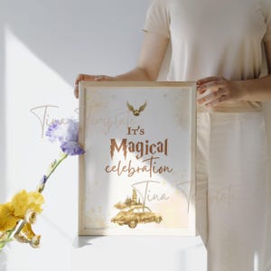 May include: A printable sign with a watercolor illustration of a flying car and Hogwarts castle. The text reads "It's Magical Celebration".