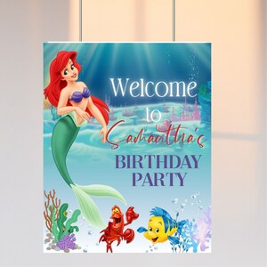 May include: A welcome sign for a birthday party featuring Ariel, the Little Mermaid, with Sebastian and Flounder. The sign is blue with white text that says "Welcome to Samantha's Birthday Party".