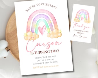 May include: A rainbow-themed birthday invitation featuring a watercolour rainbow, clouds, and stars. The invitation reads "Join us to celebrate Carson is turning two" and includes the date, time, and location of the party. The RSVP information is also provided.