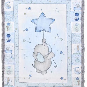 May include: A blue and white baby blanket with a gray elephant holding a blue star balloon. The blanket has a gray ruffled border and a patchwork design with stars and moons.
