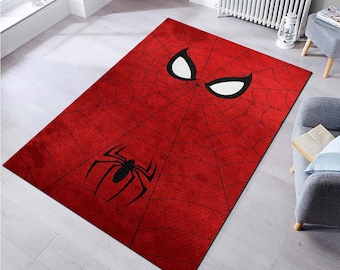 May include: Red and black area rug with a spider web design and a spider in the bottom left corner. The top part of the rug features a white and black spider-man eye design.