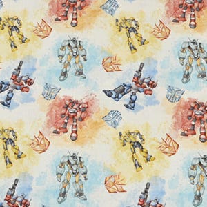 Puede incluir: Tela con un patrón repetido de robots en rojo, amarillo, azul y gris. El diseño incluye figuras de robots y formas geométricas sobre un fondo blanco con salpicaduras de acuarela coloridas. Adecuado para varios proyectos de manualidades.