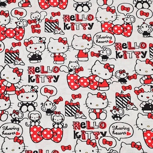 Tela de Hello Kitty, estampado de dibujos animados y anime, se vende por medio metro.