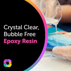 May include: Crystal clear, bubble free epoxy resin being poured into a mold. The resin is clear and viscous, and it is being poured slowly and carefully.