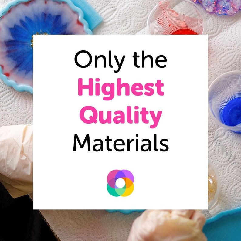 May include: White card with the text "Only the Highest Quality Materials" in black and pink text. A colorful circular logo is below the text. The card is on a white surface with various resin art pieces and paint.