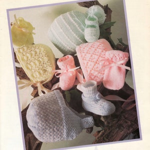 May include: An assortment of knitted baby accessories, including hats, booties, and mittens, in pastel colors like yellow, pink, and blue. The image features the text "Baby Accessories" at the top, suggesting a collection of handmade or vintage baby items.