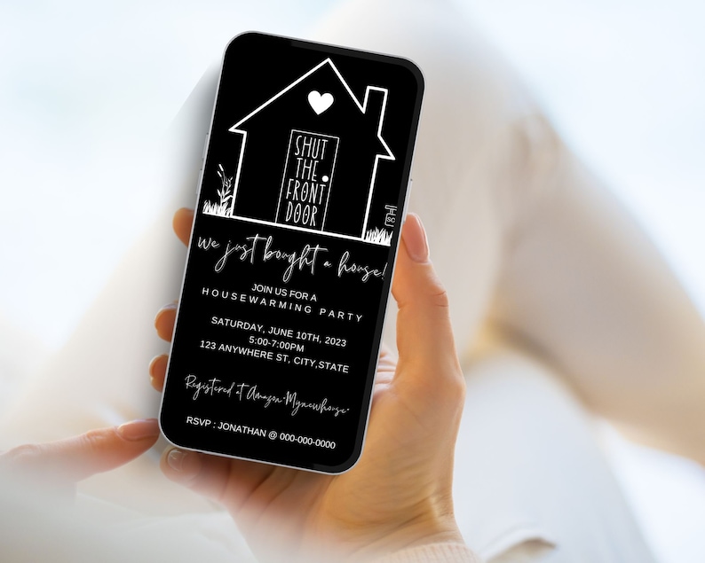 May include: A black and white housewarming party invitation on a smartphone screen. The invitation features a stylized house with a heart and the text "Shut the front door! We just bought a house!"  Join us for a housewarming party on Saturday, June 10th, 2023 from 5:00-7:00 PM at 123 Anywhere St, City, State. RSVP: Jonathan @ 000-000-0000.