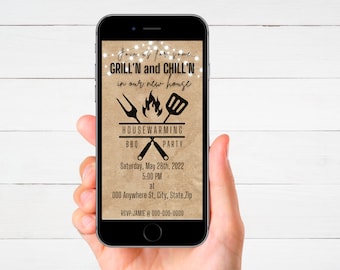May include: A smartphone displaying a housewarming party invitation with a brown background and string lights. The invitation reads "Join us for some Grill'n and Chill'n in our new house" with a grill and spatula graphic. The event is a BBQ party on Saturday, May 28th, 2022 at 5:00 PM. The address is 000 Anywhere St, City, State, Zip. RSVP to Jamie at 000-000-0000.