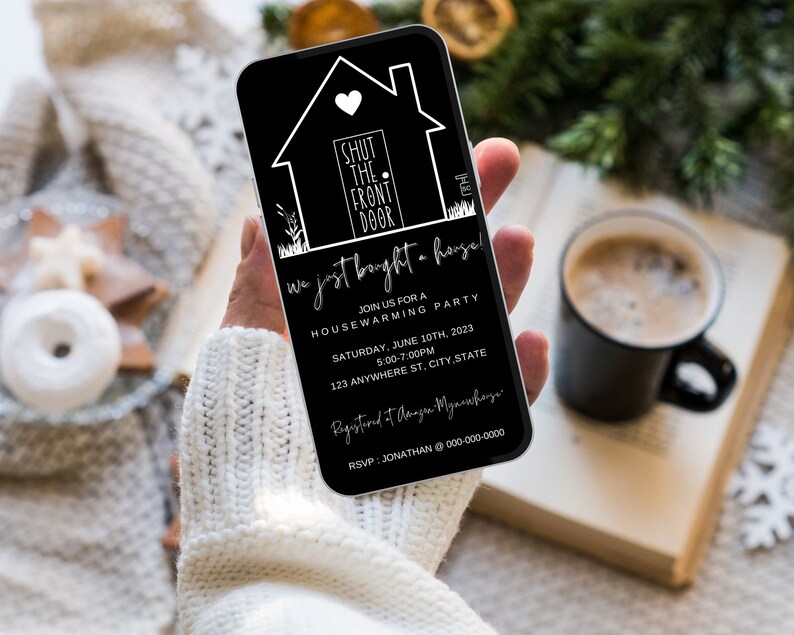 May include: Black and white housewarming party invitation on a smartphone. The invitation features a house icon with the text "Shut the front door" and the words "We just bought a house!" The invitation includes the date, time, and address of the party.