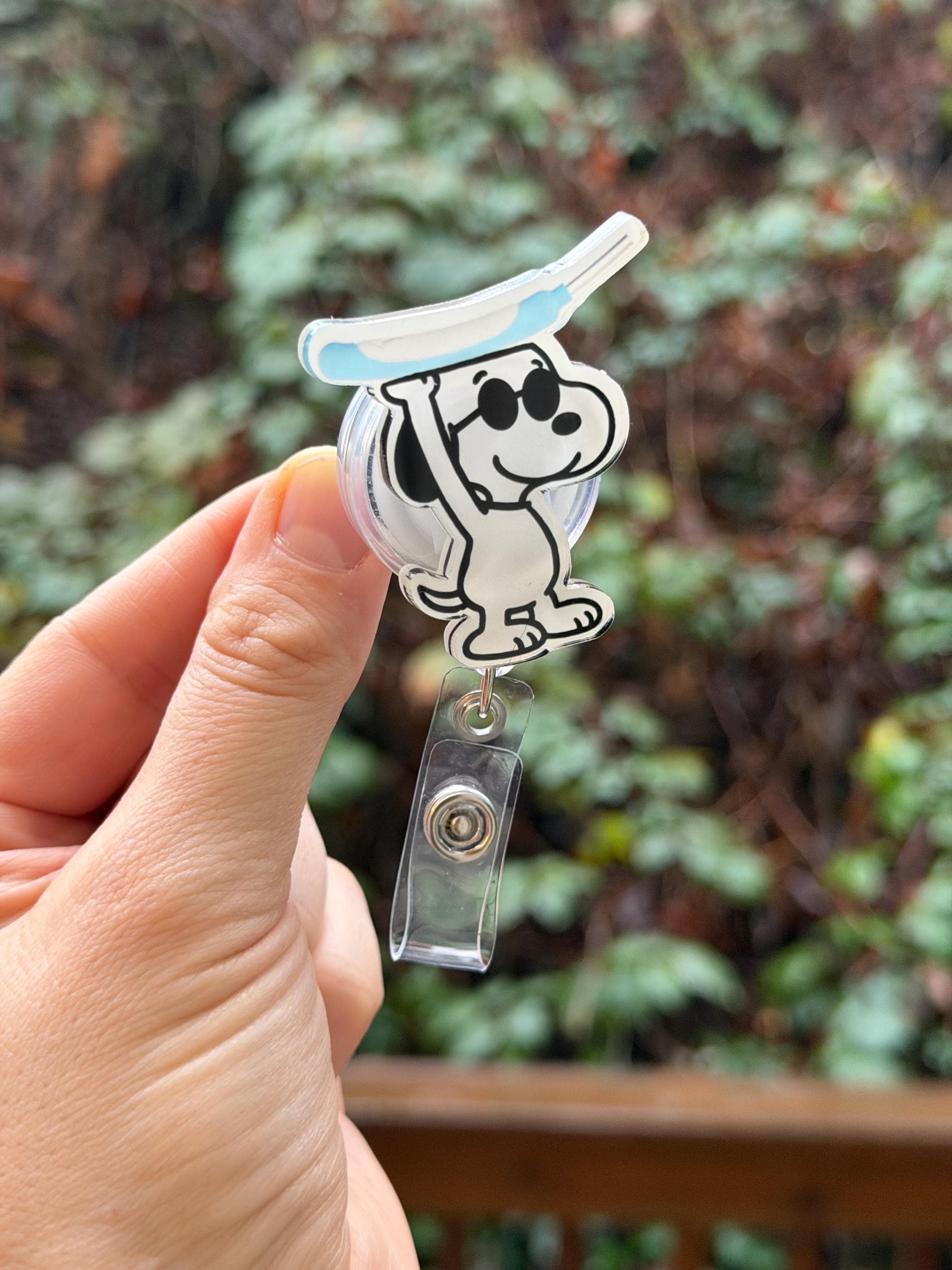 Cartoon Dog Holding a Purewick- Nurse Badge Reel, RN, MD, Pharmacy