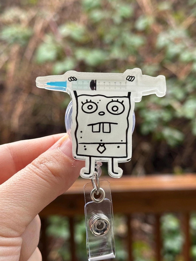 Cartoon Doodle with Syringe Badge Reel image 1