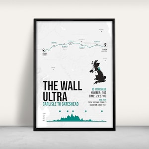 May include: A framed print showing a map of the Wall Ultra race route from Carlisle to Gateshead. The print includes race details: number 162, time 21:57:02, total distance 112.65 km, and elevation 1,054.63 metres.
