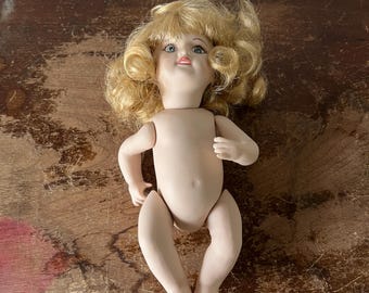 Vintage Diminutive Porcelain Articulated Doll