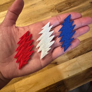 Grateful Dead 13 Point Lightning Bolt Iron On Patches - Pack of 3 - 1 Each: Red, White, and Blue