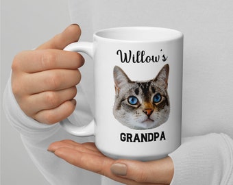 May include: White ceramic mug with a cat's face and the text "Willow's Grandpa" printed on it.