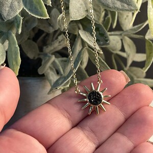 Black Druzy Sunburst necklace.  Gold chain.  16 inch chain.