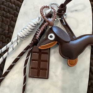 Daschund bag charm.  Daschund key chain/chocolate bar. Coffee colored Daschund. White and Brown Rope