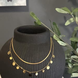 Gold coin layered necklace.  Gold coin and snake chain layered set.  Stainless Steel.