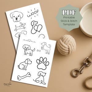May include: Two white sheets of paper with black line drawings of dogs, bones, and paw prints. The text "PDF Printable Stick & Stitch Template" is on a green shape. A beige rope ball, a dog bowl, and a leash are also in the image.