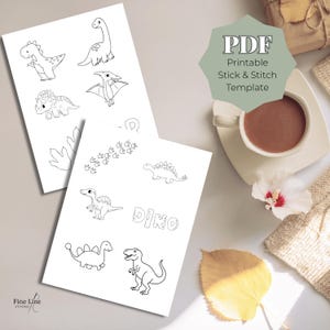 May include: Two white sheets with black line drawings of dinosaurs, footprints, and the word "Dino". A cup of coffee, a leaf, and a sweater are in the background. The text "PDF Printable Stick & Stitch Template" is on a green shape.