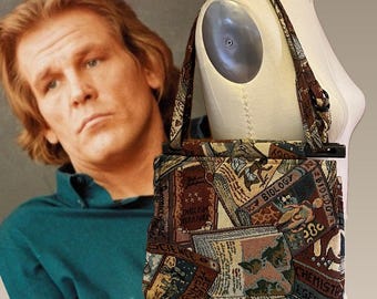 May include: A shoulder bag with a tapestry design featuring book covers with titles like "Biology" and "English Literature." The bag has a brown strap and a black frame. The bag is displayed on a mannequin.