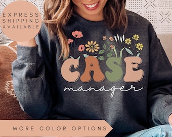 May include: Dark grey heather sweatshirt with a floral design and the text "CASE manager" in colorful, retro-style letters.