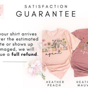 May include: Two t-shirts with the text "Real Estate Agent" in a colourful floral design. The shirts are in the colours heather peach and heather mauve. The text "Satisfaction Guarantee" is at the top of the image. The text "If your shirt arrives after the estimated date or shows up damaged, we will issue a full refund." is in the centre of the image.