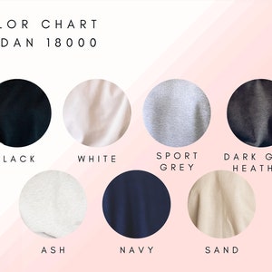 May include: Color chart for Gildan 18000 t-shirts showing the colors black, white, sport grey, dark grey heather, ash, navy, and sand.