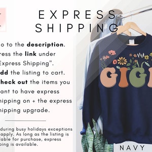 May include: Navy blue sweatshirt with the word "GIGI" in colorful, retro-style letters with flowers growing from the letters. The text "EXPRESS SHIPPING" is at the top of the image.
