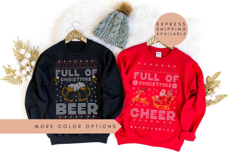 May include: Two Christmas sweaters, one black with a beer mug design and the text "Full of Christmas Beer", and one red with a reindeer and sleigh design and the text "Full of Christmas Cheer".