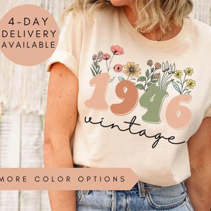 a woman wearing a white t-shirt with a floral design and the text "1946 Vintage" printed on it. The t-shirt is described as a "4-day delivery available" and "more color options natural".