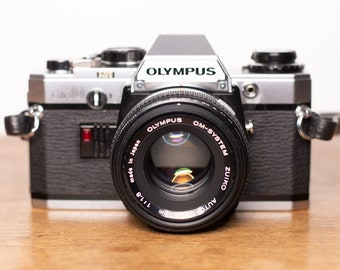 Olympus OM 10 mit Zuiko 50mm f/1.8 Objektiv - SLR - analoge Kamera - sehr guter Zustand - vintage