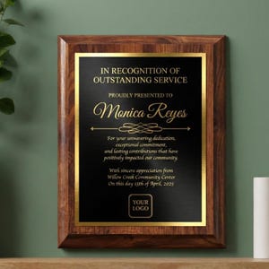 Customizable cherry finish recognition plaque with black-and-gold engraved plate, displaying personalized name, dedication message, date, and optional logo.