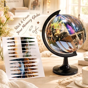 May include: A black globe stand with a spherical frame and a sheet of adhesive photo strips featuring various images of people. The text Stick & Create Your Memory Globe is printed on the sheet along with icons of a glue stick and scissors.