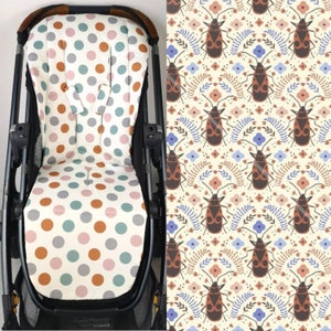 Könnte beinhalten: Ein weißer Kinderwagen-Sitzbezug mit einem Tupfenmuster in den Farben Rosa, Orange und Türkis. Der Bezug ist aus weichem, atmungsaktivem Stoff gefertigt und passt auf die meisten Standard-Kinderwagen-Sitze.