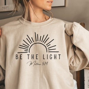 Be the Light Sweatshirt | Matthew 5:14 Crewneck Pullover | Sweatshirt Gift for Christians | Bible Verse Church Sweater | Baptism Gift